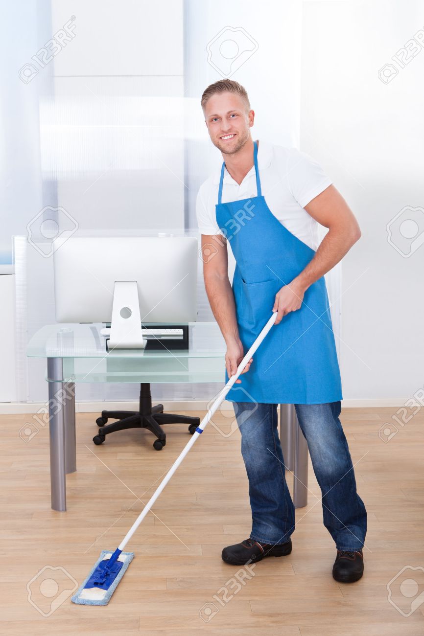شركة المثالية لتنظيف الشقق بالدمام والخبر 0550091502 27011119-handsome-male-janitor-or-cleaner-cleaning-the-floor-in-an-office-building-using-a-mop-to-wash-the-an-stock-photo